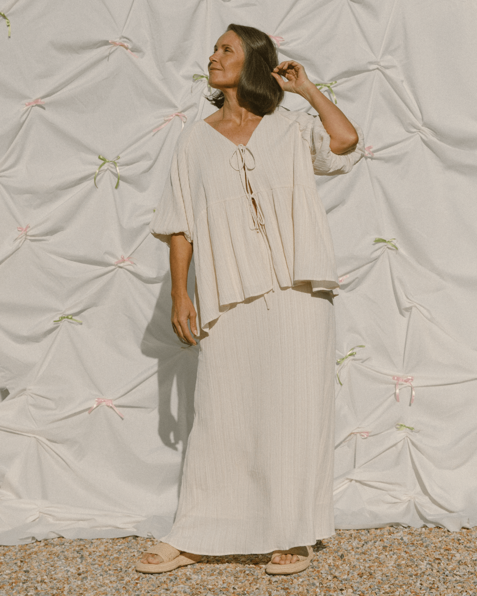 Woman wearing cream plisse set.