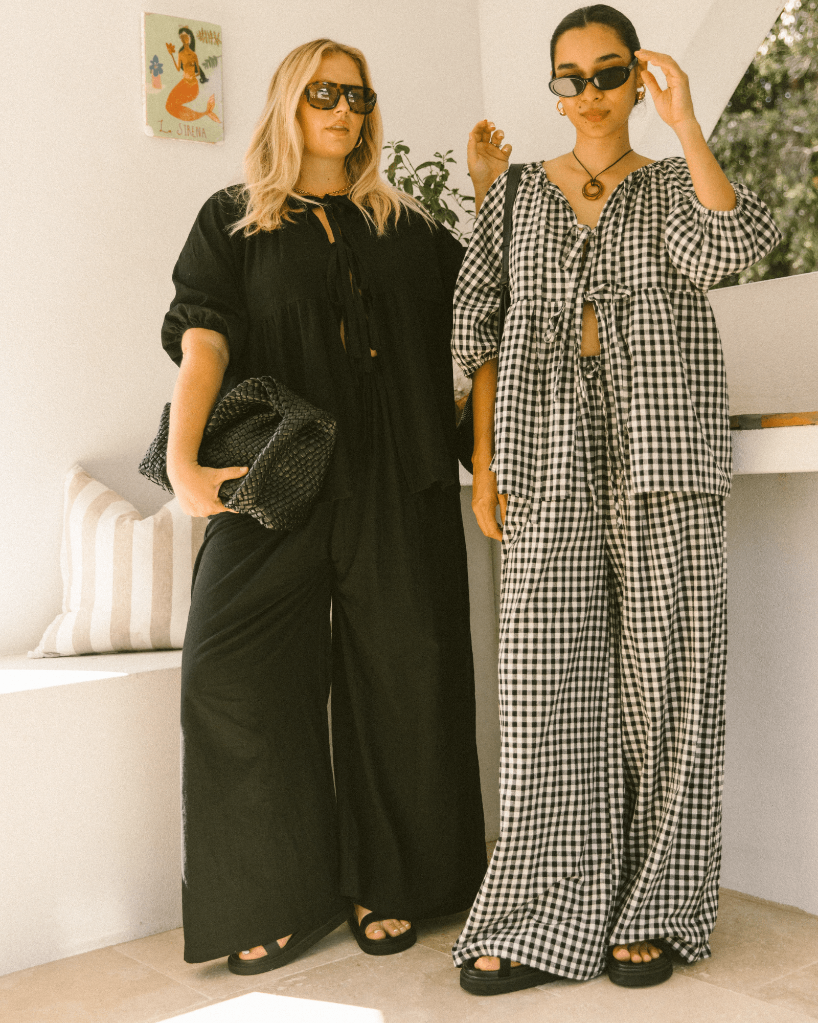 Pregnant woman wearing black maternity lounge pants - Posey Pants by The Lullaby Club