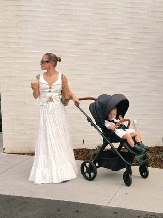 mother with baby and pram wearing lullaby club