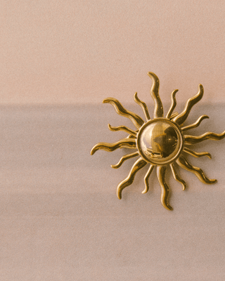 Golden Sunburst Brooch