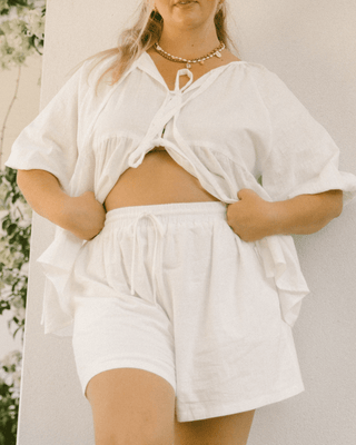 Matilda Shorts in White – Oversized maternity and postpartum lounge shorts with an elastic waistband.