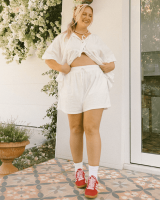 Matilda Shorts in White – Oversized maternity and postpartum lounge shorts with an elastic waistband.