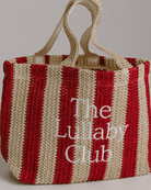 Close up of holiday style woven tote bag in red and beige stripe. 